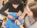 Young people working on a kit.